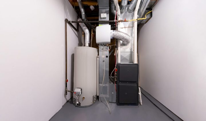 A furnace installed in a spacious utility room of a bustling commercial property with connected Industrial pipes and ducts