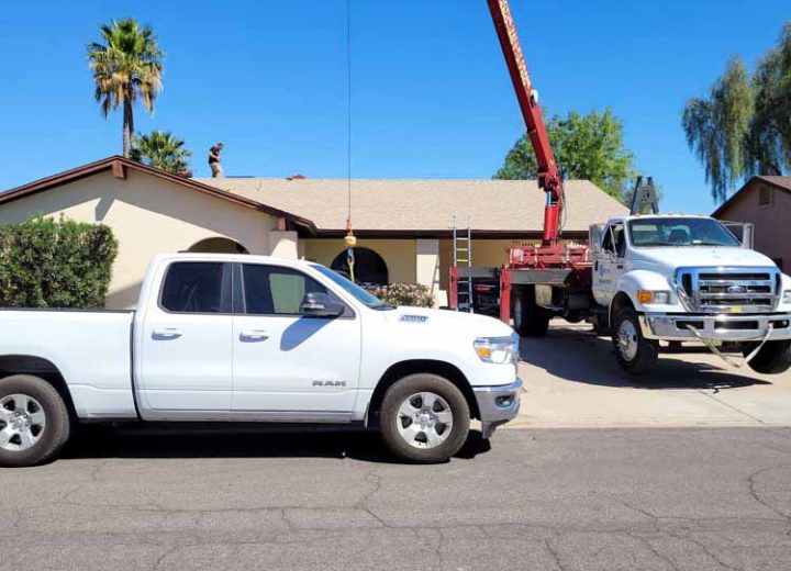 Lynx Air Service Team Truck mounted with crane parked on a residential area where they provide services